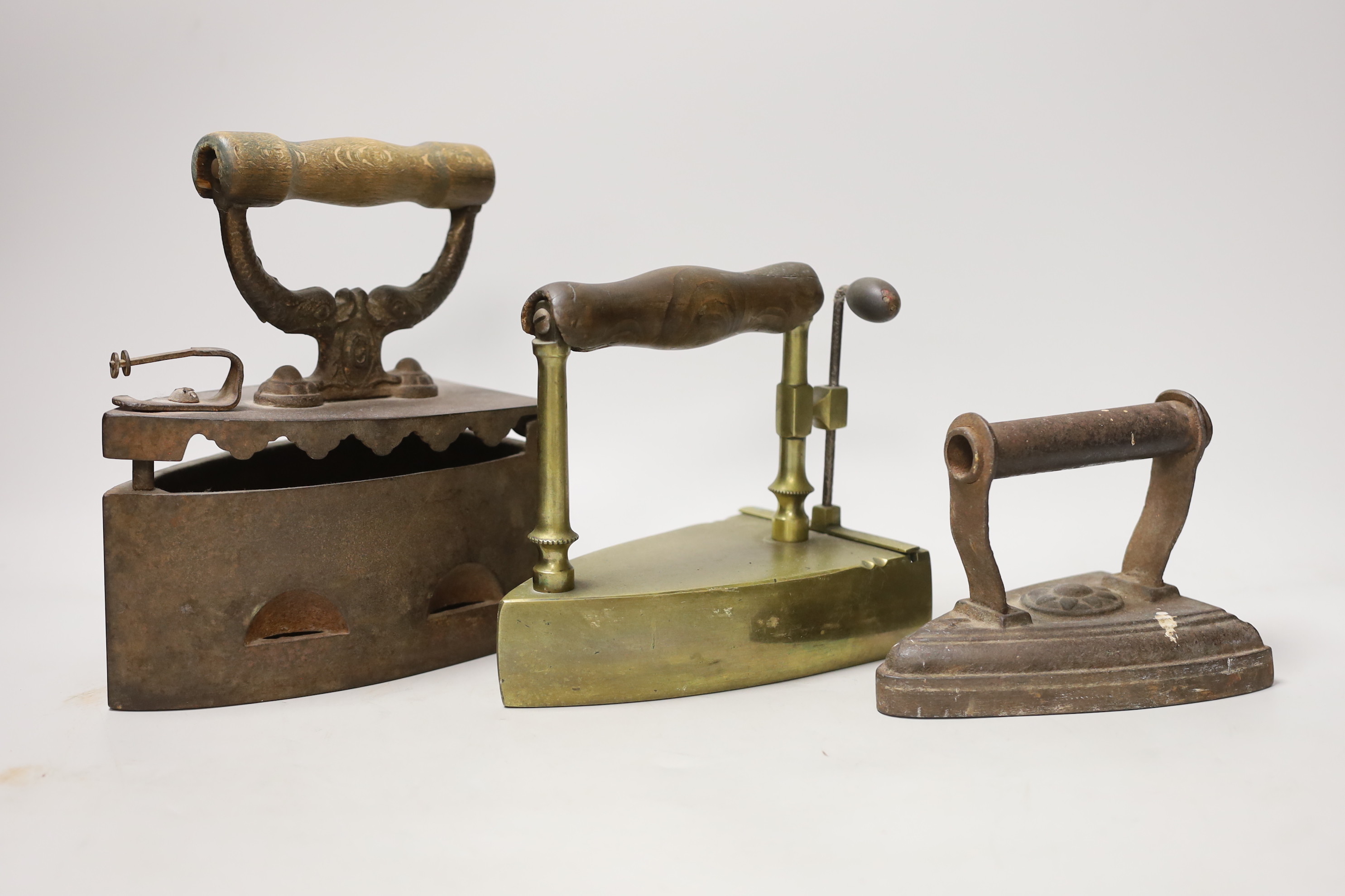 Three 19th century irons, tallest 23cms high